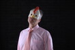 © serikbaib - man in a mask of a rooster