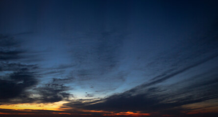 defocused background of sunset in dark blue sky