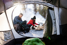 Tent Interior And Couple Camping In Snowy Forest