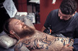 © Mr. Prof - Master tattooist does a tattoo in the Studio