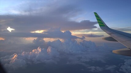 Sticker - A Beautiful view of an airplane wing in the cloudy sky