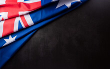 Happy Australia Day Concept. Australian Flag Against Dark Stone Background. 26 January.