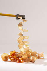 Wall Mural - Vertical of a pencil being sharpened against the white background