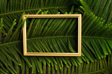Aufkleber - Christmas golden picture frame with pine leaf and bauble decor on wood table