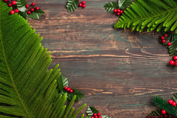 Aufkleber - christmas pine leaf and mistletoe on wooden table,red