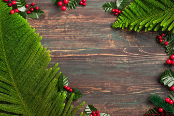 Aufkleber - christmas pine leaf and mistletoe on wooden table,red