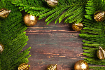 Aufkleber - Christmas pine leaf with golden bauble decoration on wooden table
