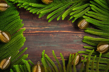 Aufkleber - Christmas pine leaf with golden bauble decoration on wooden table