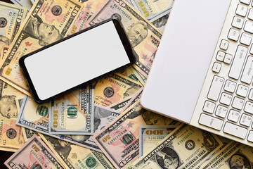 Poster - Lay of a smartphone and a notebook on dollar bills