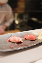 Poster - Closeup shot of tuna sashimi on a stone plate