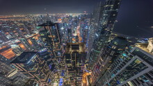 Skyline Panoramic Look Down View Of Dubai Marina Showing Canal Surrounded By Skyscrapers Along Shoreline Night Timelapse. DUBAI, UAE