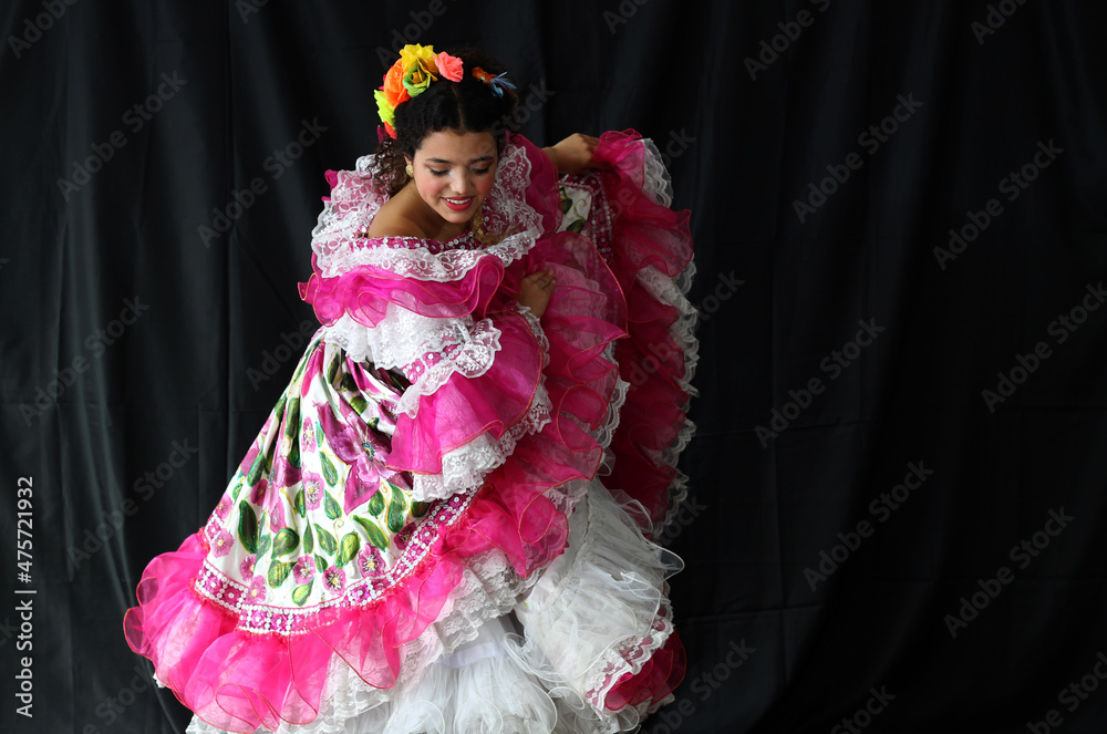 Portrait of young Colombian girl dancing wearing traditional folklore  Sanjuanero Huilense costume dress in pink and white with flowers Stock  Photo | Adobe Stock