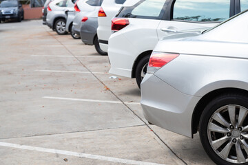 Car parking in line and car running background.