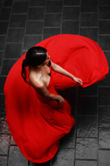 Poster - Vertical shot of an East Asian girl wearing a beautiful red dress