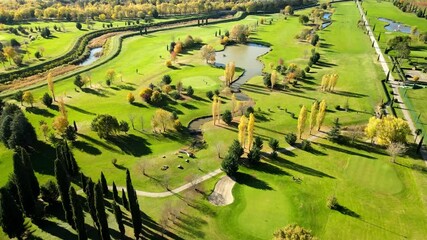 Poster - A 4K aerial footage of a golf course on a sunny weather