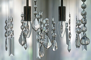 closeup of a luxurious chandelier with ornaments with a blurry background