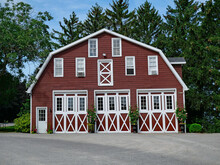Two Story Barn With Horizontal Wooden Planks Stained Dark Red