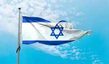 Israeli Flag Waving On A Pole In A Blue Sky