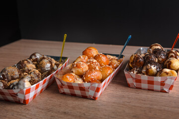 Sticker - Closeup shot of delicious fried doughnuts with caramel and chocolate sauce