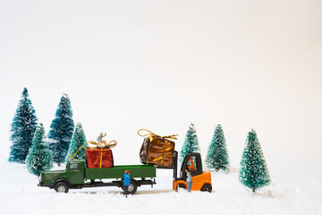 Wall Mural - Loading of a truck with Christmas gifts with a forklift on a white background