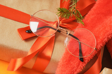 Sticker - beatiful trendy eye glasses on gift box with red ribbon, christmas optic store sale