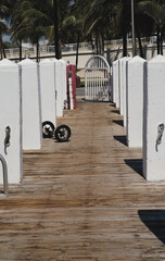 view of a Walkway from wooden boards along the ocean shore in Pompano Beach in Florida, USA