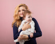 © rubchikova - mother and daughter isolated on pink