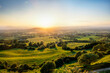© Trevor Woodville - Sunset over green fields of Gloucestershire viewed from Crickley Hill.