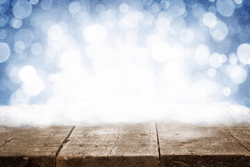 Wall Mural - Winter Christmas scenic background with wooden table and copy space.