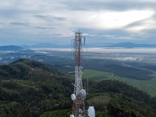 Wall Mural - Mesmerizing shot of a telecommunication tower under the cloudy skies