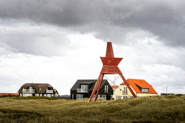 Sticker - Traditional houses on the meadow in Lokken, Nordjylland, Denmark under a gray sky