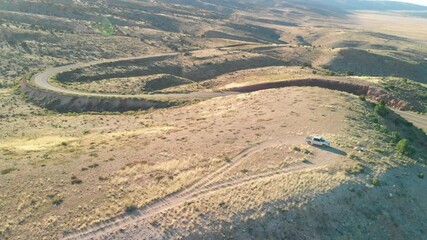 Canvas Print - Road across the canyon mountains, aerial view from drone.