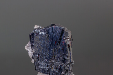 macro mineral acanthite stone on a black background