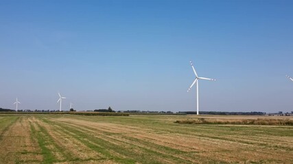 Canvas Print - Alternative renewable energy concept, windmill turbines in the field. Aerial view of rotating windmill power generator