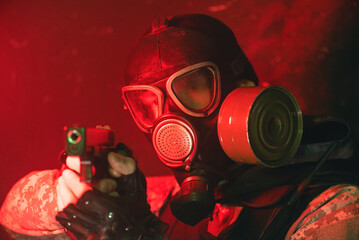 Sticker - A soldier in gas mask with a gun in the smoke. Post apocalypse soldier concept.