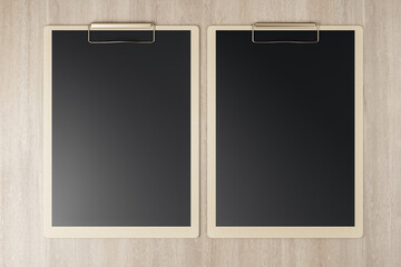 Poster - Top view and close up of empty black clipboards on wooden backdrop, Stationery and mock up supplies concept. 3D Rendering.