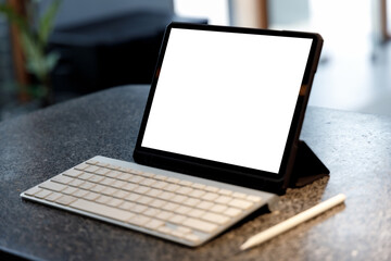 Poster - Blank screen laptop computer modern man use room laptop with blank white desktop screen with coffee cup on wooden table in cafe