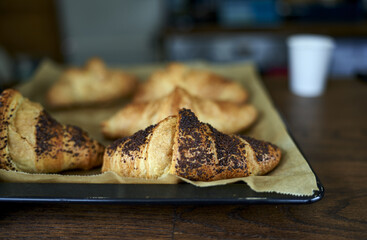 Poster - Selective focus shot of newly cooked Croissants with chocolate powder on i