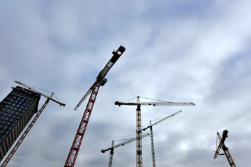 Wall Mural - Low angle shog of cranes in the building site in Antwerp, Belgium