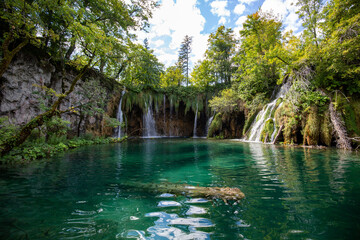 Sticker - Scenic view of  small waterfalls in Plitvice Lakes National Park on a sunny day, Croatia