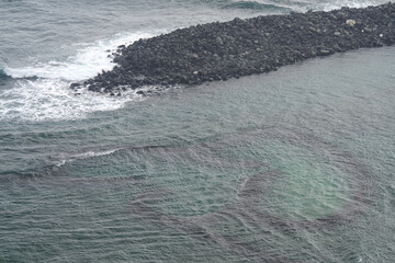 Wall Mural - Twin Hearts Stone Weir cover in water at Penghu island