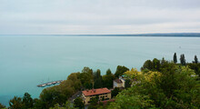Beautiful View Of The Balaton Lake With Coastline Buildings And Trees Under A Clear Sky In Hungary