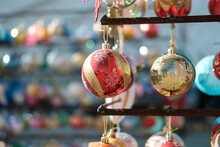 Various Colorful Christmas Balls With Blurred Baubles Background, Selective Focus