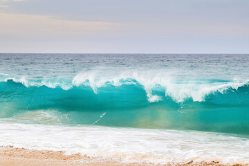 Wall Mural - Powerful ocean blue waves with white foam. Marine landscape..