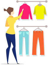 Girl Choosing Clothes For Trousers And Shirts Fluttered On Hangers, Elements Of Wardrobe In Store. Woman Standing In Front Of Hangers And Choosing Outfit. Fashion, Clothes Store, Shopping Concept.