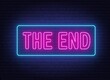 The end neon sign on brick wall background.