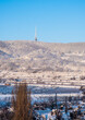 © Zuzana - Winter in Bratislava Nove Mesto. Little Carpathians in winter, Kamzik TV tower and snowy landscape on a sunny day with blue sky