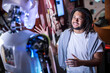 © Westend61 - Technician trying to communicate with human robot at workshop