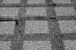 © Westend61 - Checked pattern on paved surface