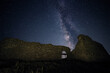Beautiful view of Milky Way galaxy over the ruins of Enisala citadel